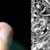 Composite of a child sitting on a hand.
